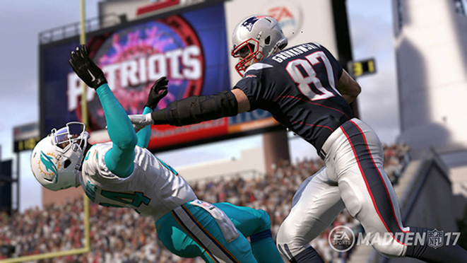 Gronks stiff arms a Miami defender.